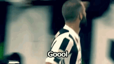 a soccer player is wearing a black and white jersey and says goool .