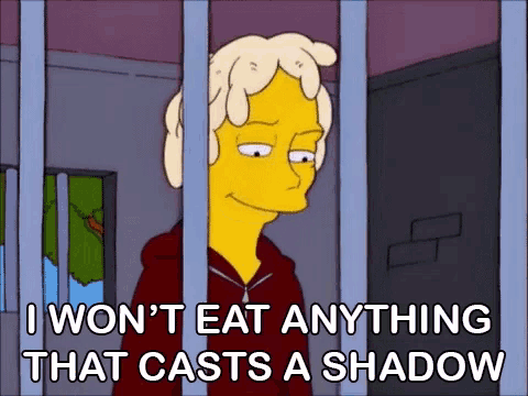a cartoon character behind bars with the words i won t eat anything that casts a shadow