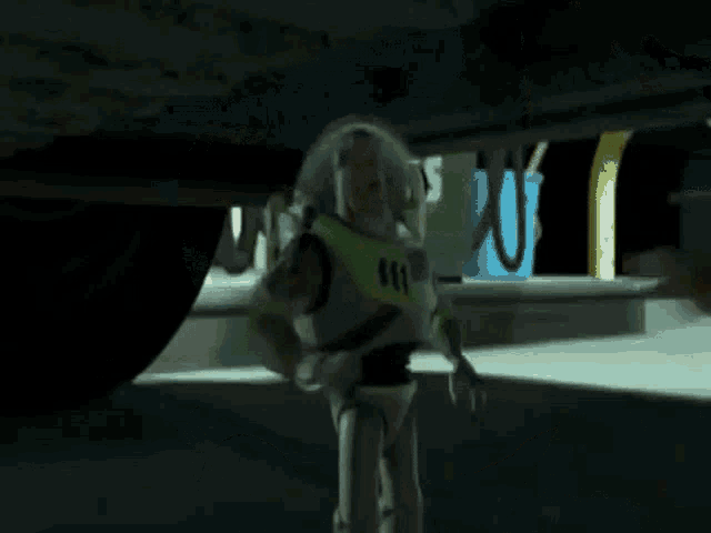 toy story buzz lightyear is laying on the ground