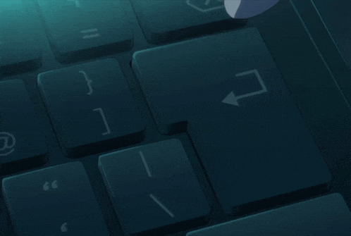 a person is typing on a keyboard with a few keys including the i key