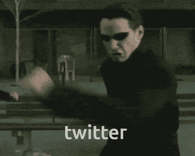 a blurred image of a person with the word twitter written on it