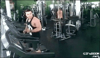 a man is running on a treadmill in a gym while holding a saxophone .