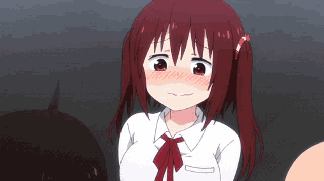 a girl with red hair is wearing a white shirt with a red bow tie
