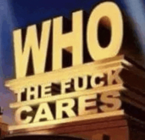 a sign that says `` who the fuck cares '' is sitting on top of a building .