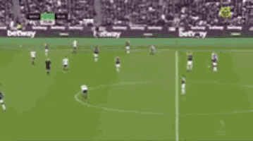 a blurry picture of a soccer game with a banner that says norway on it