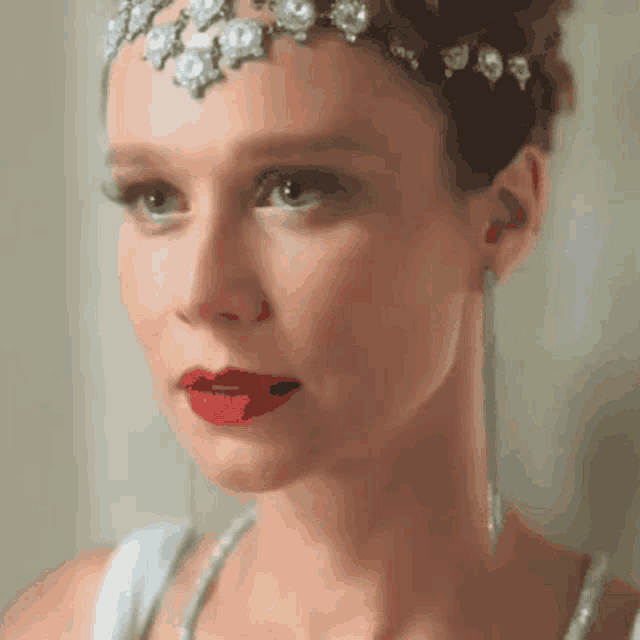 a close up of a woman 's face with red lips
