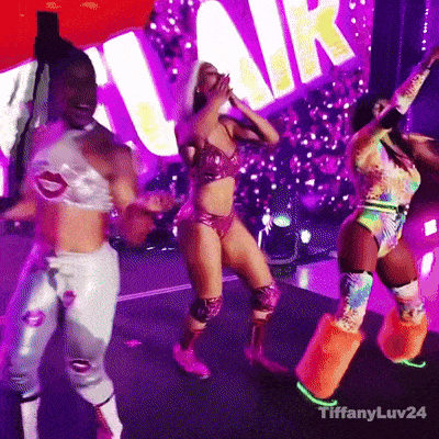 a group of women are dancing in front of a sign that says " tiffanyluv24 "