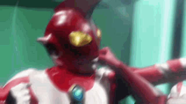 a close up of a person wearing a red and white costume with horns .