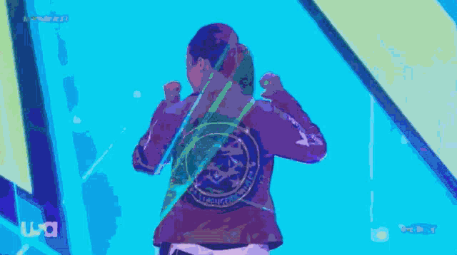 a person in a purple hoodie with the word usa on it