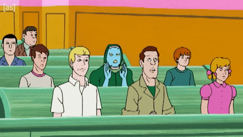 a group of people are sitting in a classroom with the letters a & s on the bottom right