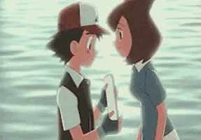a boy and a girl are standing next to each other looking at each other .