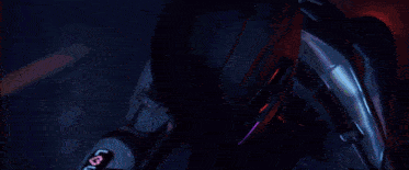 a person wearing a purple helmet with a skull on it is sitting on a motorcycle .