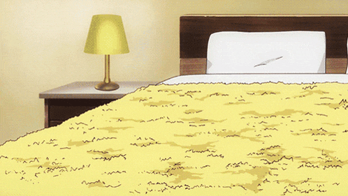 a girl is laying on a bed with her legs outstretched