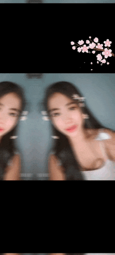 a blurry picture of a woman with flowers on her hair