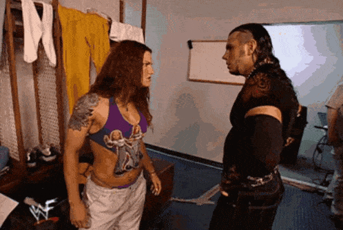 a man and a woman are standing next to each other