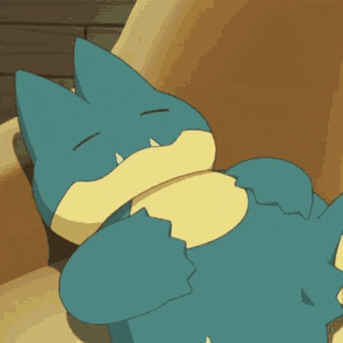 a blue and yellow cartoon character is laying on a couch