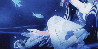 a girl in a blue dress is sitting in the water
