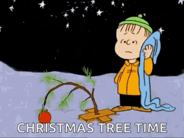 a cartoon of charlie brown standing next to a christmas tree .