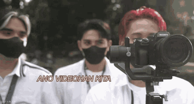 a group of men wearing masks and a camera that says sony on it