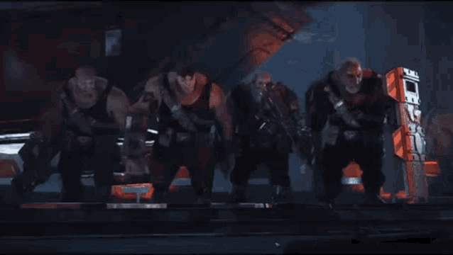 a group of men are standing next to each other and one of them has a camera on his chest