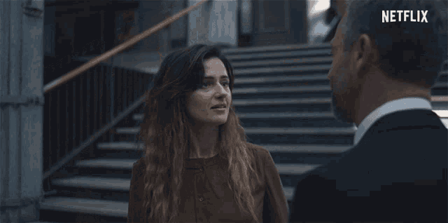 a man and a woman are talking and the woman says " well say it "