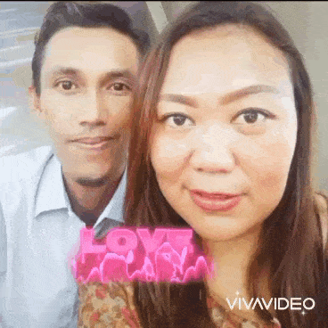 a man and a woman are posing for a picture together and smiling .