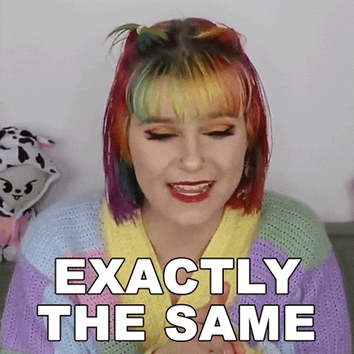 a woman with rainbow hair is wearing a sweater and says exactly the same