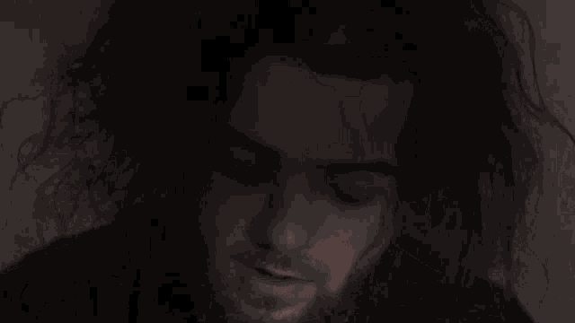a close up of a person 's head and hair