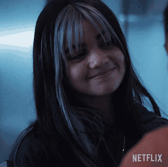 a close up of a woman 's face with netflix written on the bottom