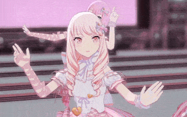 a girl with pink hair and a heart on her chest is dancing