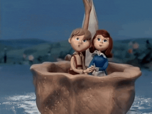 a boy and a girl are covering their eyes in a boat
