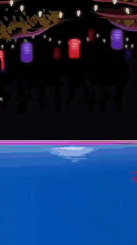 a purple light is shining on a blue surface with lanterns in the background .