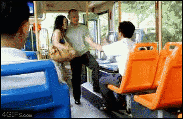 a man and a woman on a bus with the website 4gifs.com visible