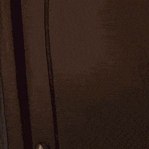 a cartoon character wearing glasses and a mask is peeking out of a doorway