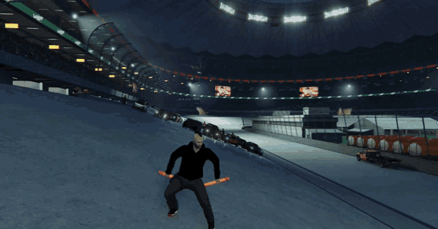 a man in a black shirt stands in a stadium holding a pair of knives in his hands