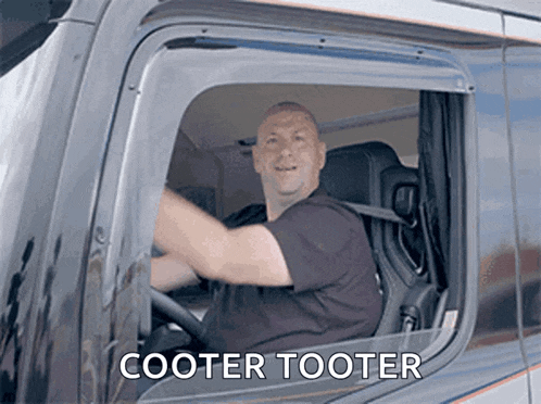 a man driving a truck with the words cooter tooter written on the side