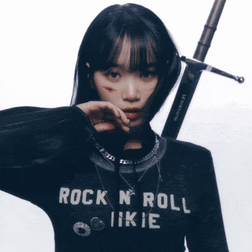 a girl wearing a black shirt that says rock n roll