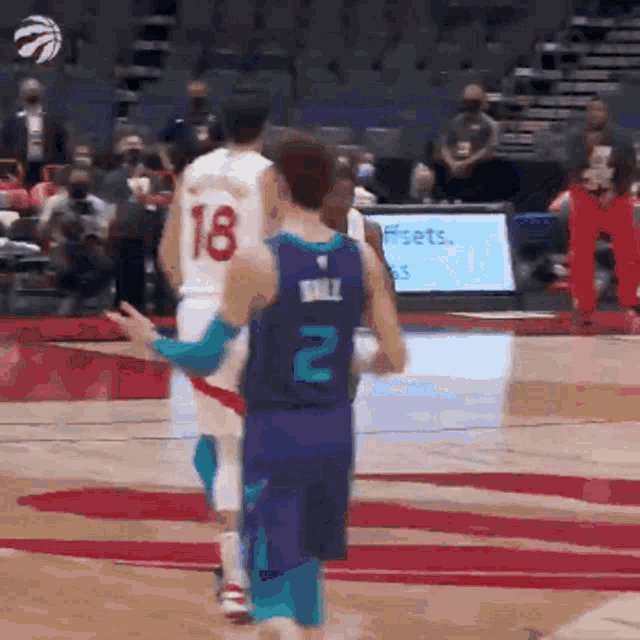 a basketball player with the number 18 on the back of his shirt