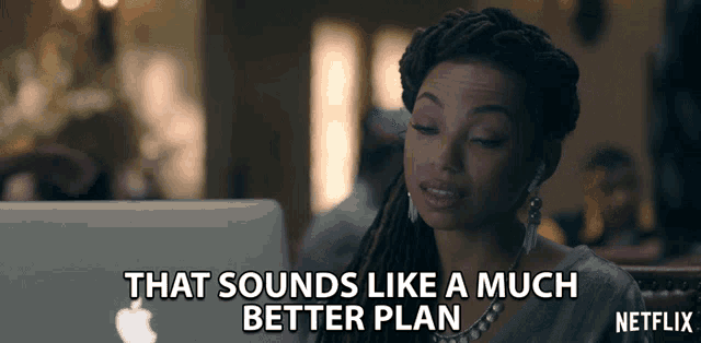 a woman sitting in front of a laptop that says that sounds like a much better plan on it