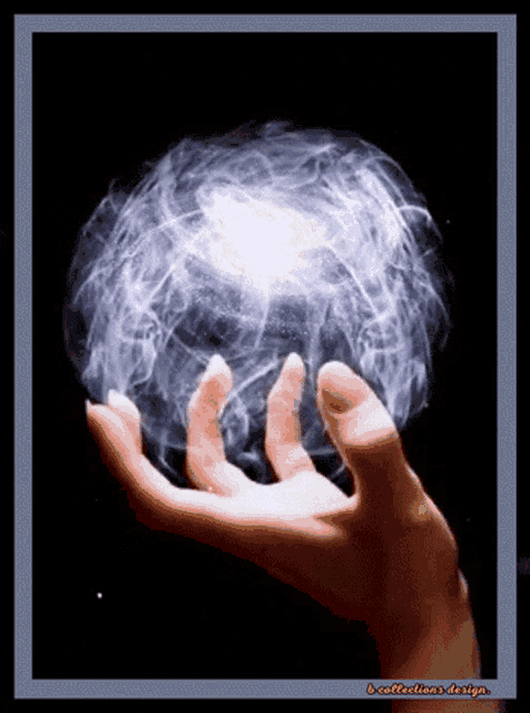 a picture of a hand holding a sphere with a reflection design