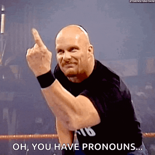 a wrestler is giving the middle finger and saying oh , you have pronouns