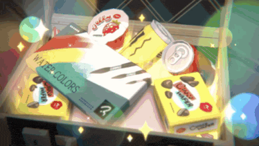 a box of watercolors sits next to a box of choco wrappers