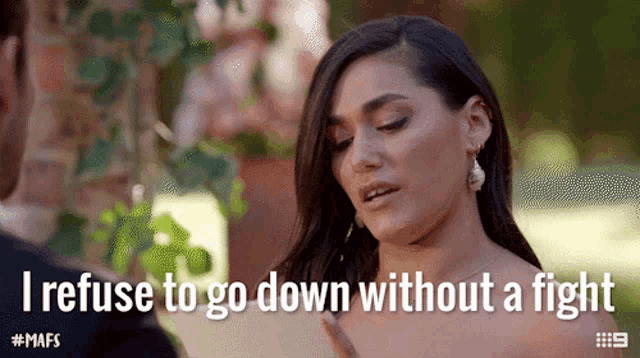 a woman refuses to go down without a fight while standing next to a man