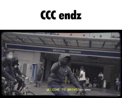a man in a hooded jacket stands in front of the brixton station