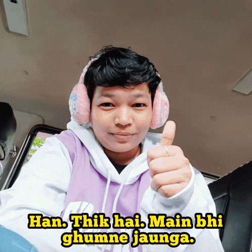 a man wearing ear muffs gives a thumbs up with the caption han thik hai main bhi ghumne jaunga
