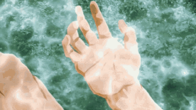 a hand is reaching out towards a green background
