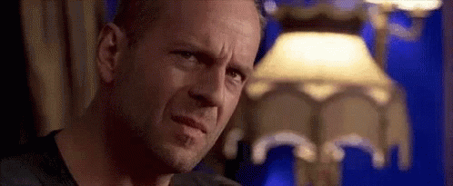 Bruce Willis Fake Smile GIF - Bruce Willis Fake Smile Unsure GIFs