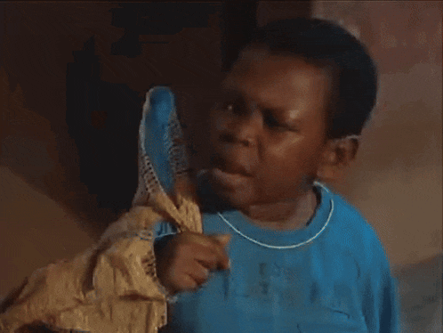 a boy wearing a blue shirt that says rebe active on it