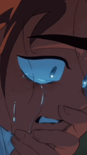 a close up of a person 's face with tears running down their eyes