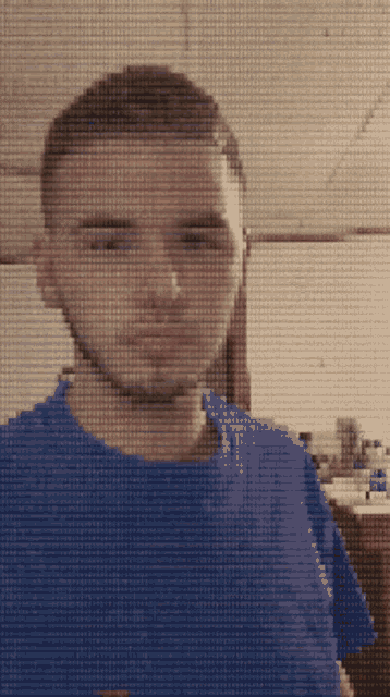 a pixelated image of a man with a blue shirt on